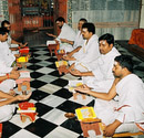 At the beginning of the yagya the priests invoke the deities in their hands.
