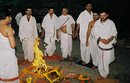 The priests walk around the fire in a ritual called pradakshina.