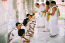 Blessing each pundit with kumkum and rice