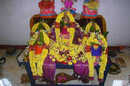 Navaratri is for Durga, Saraswati, and Lakshmi and there is a kalasha pot decorated with fresh flowers for each.